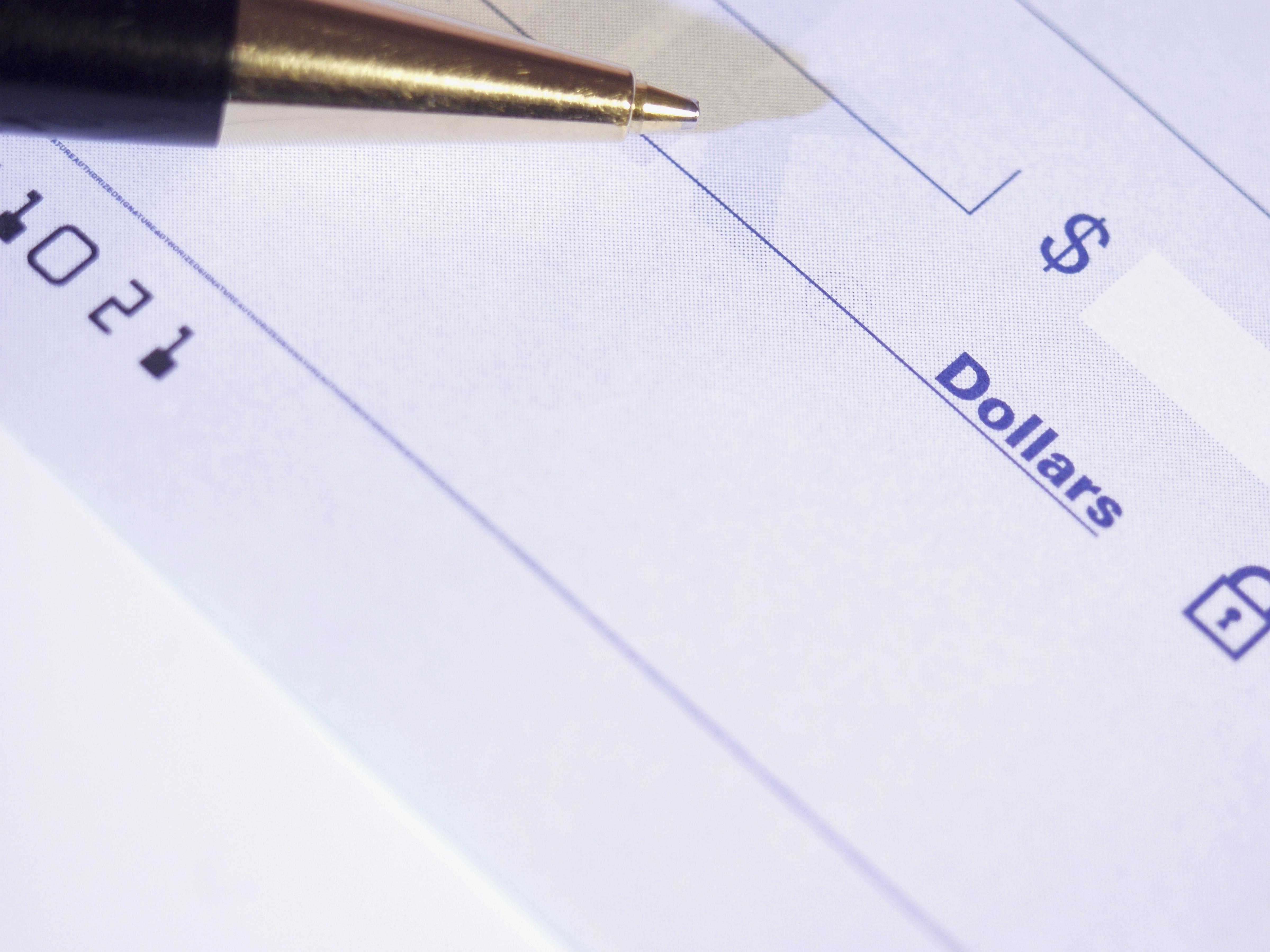 Pen over a blank check