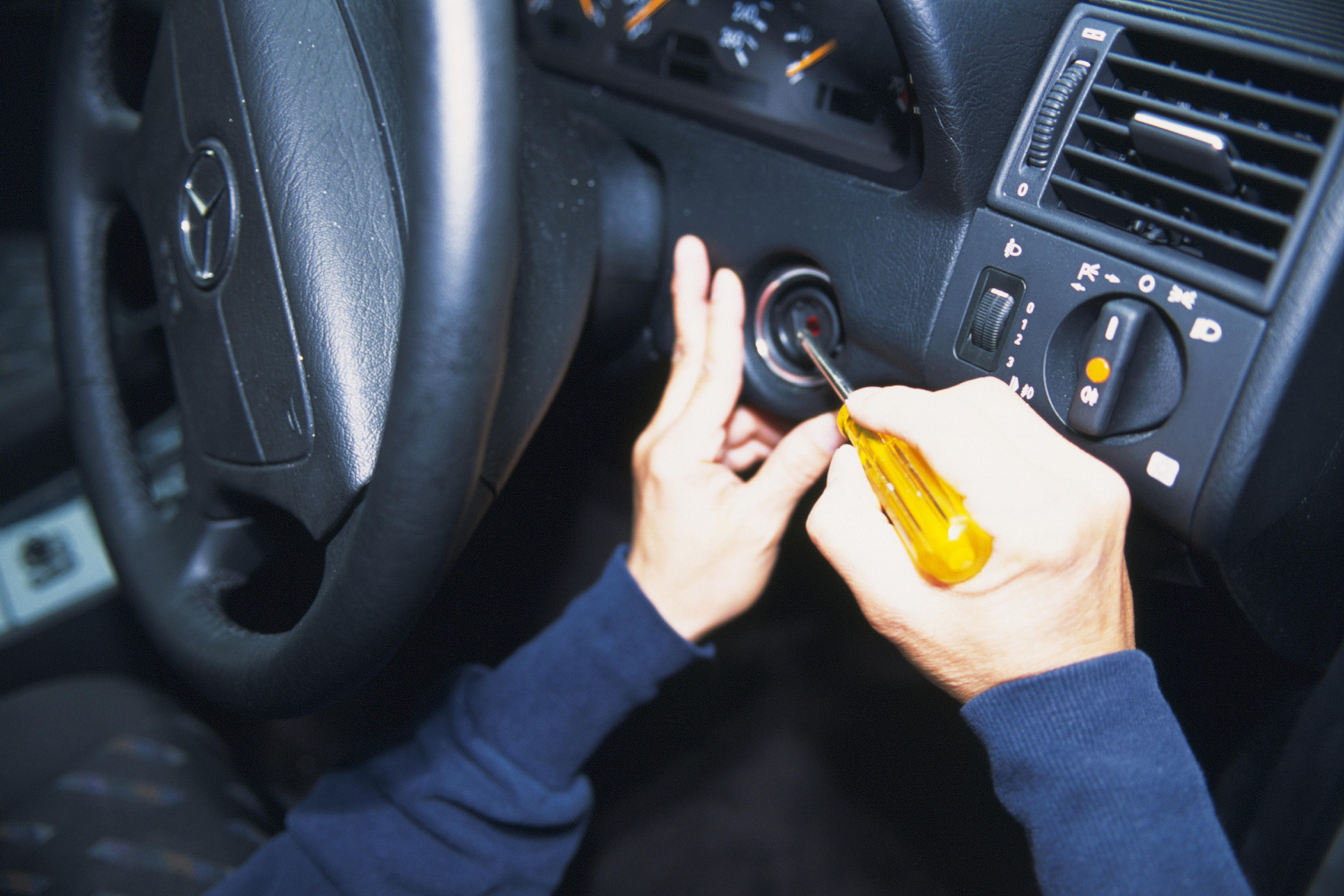 Photography of hands breaking into a car, High Angle View