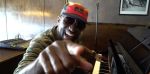 Rickey Smiley playing the piano.