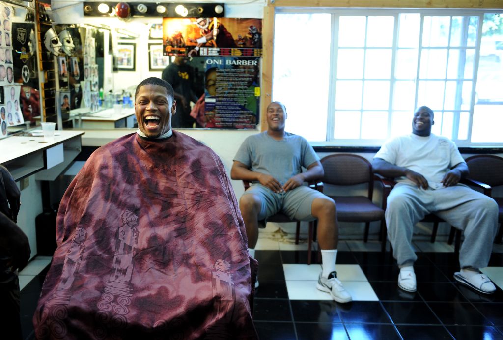 USC defensive end Nick Perry, left, shares a laugh with fellow linemen Armond Armstead and DaJohn H