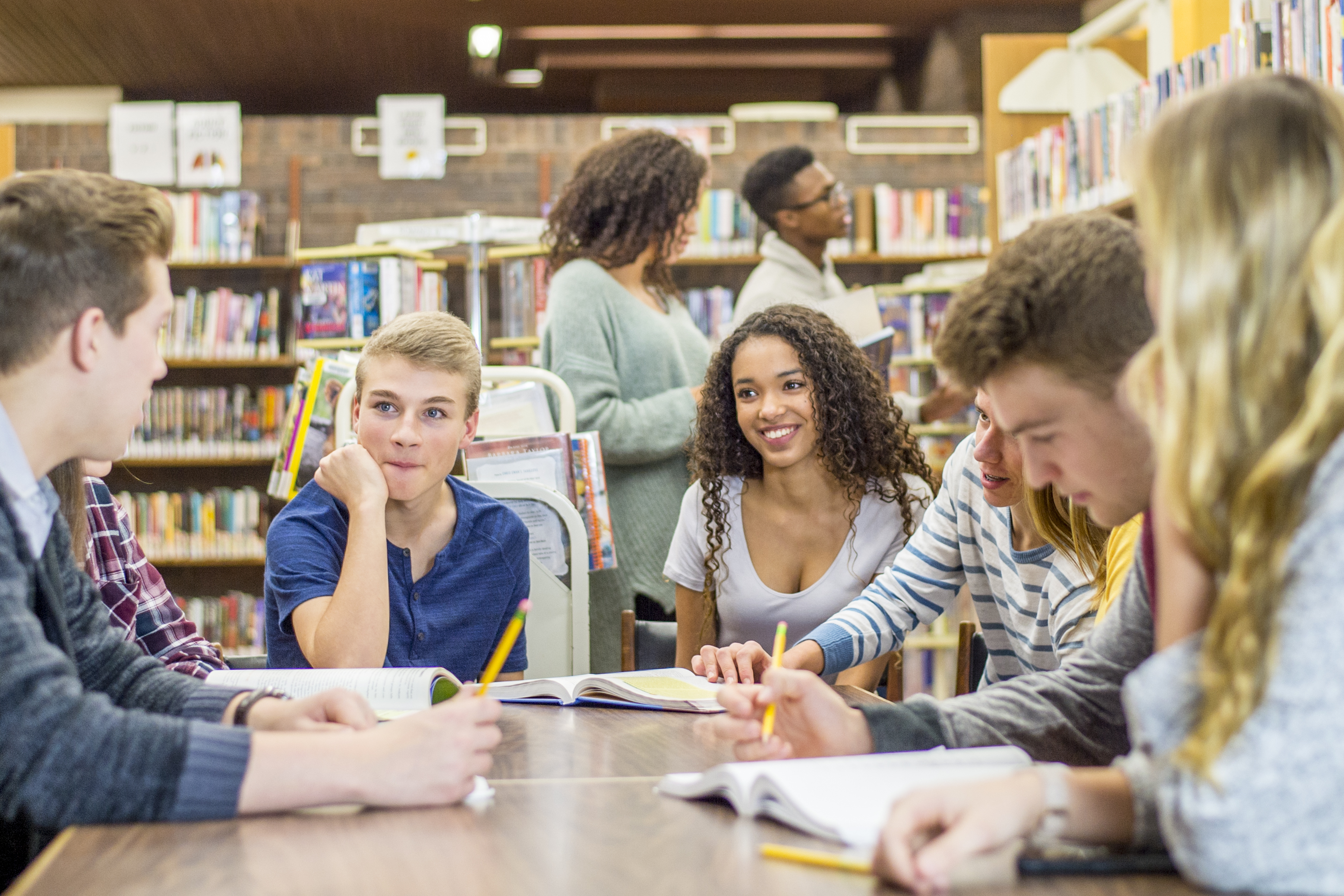 Teens Hanging Out In Library