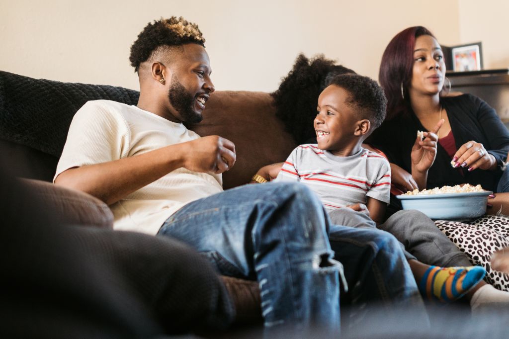A Family Watches a Movie Together at Home