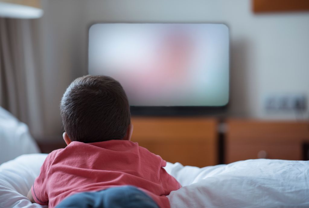 Little boy watching television